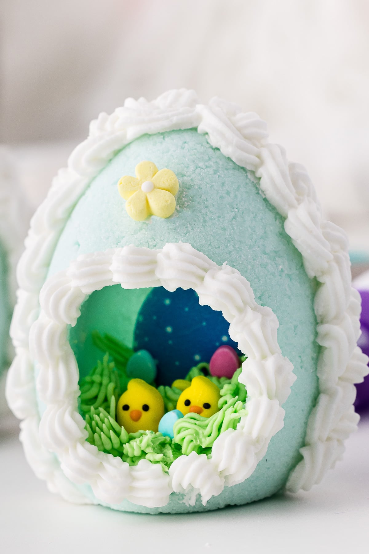 A beautiful light blue panoramic Easter sugar egg with two baby chicks on the inside