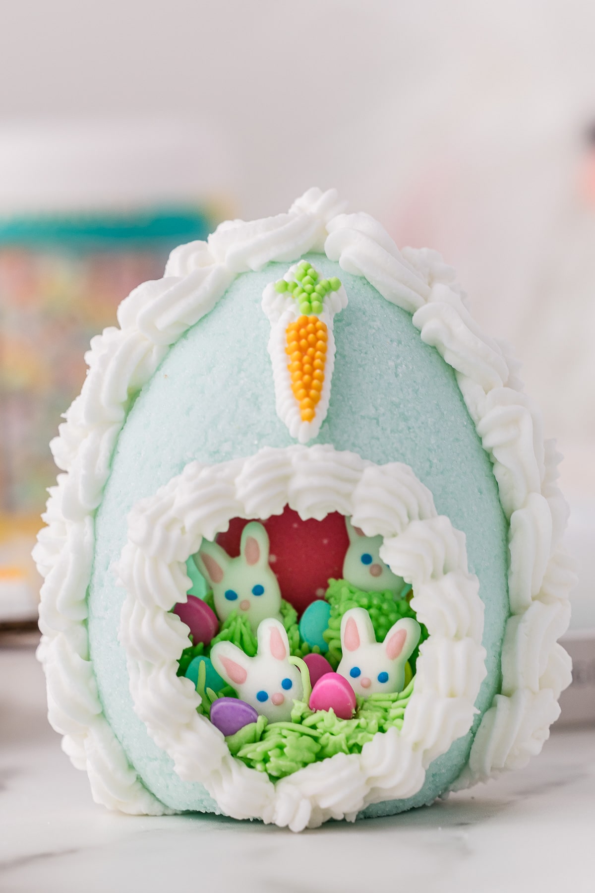 Close up of a Sugar Easter Egg with a cute panoramic peep hole showing 4 little candy bunnies inside
