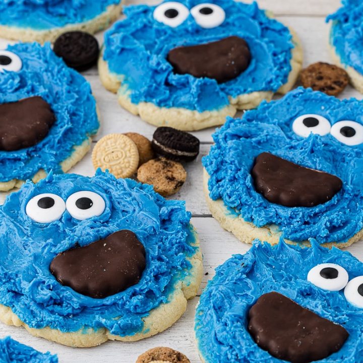 closeup of cookie monster cookies on white background with mini cookies in between
