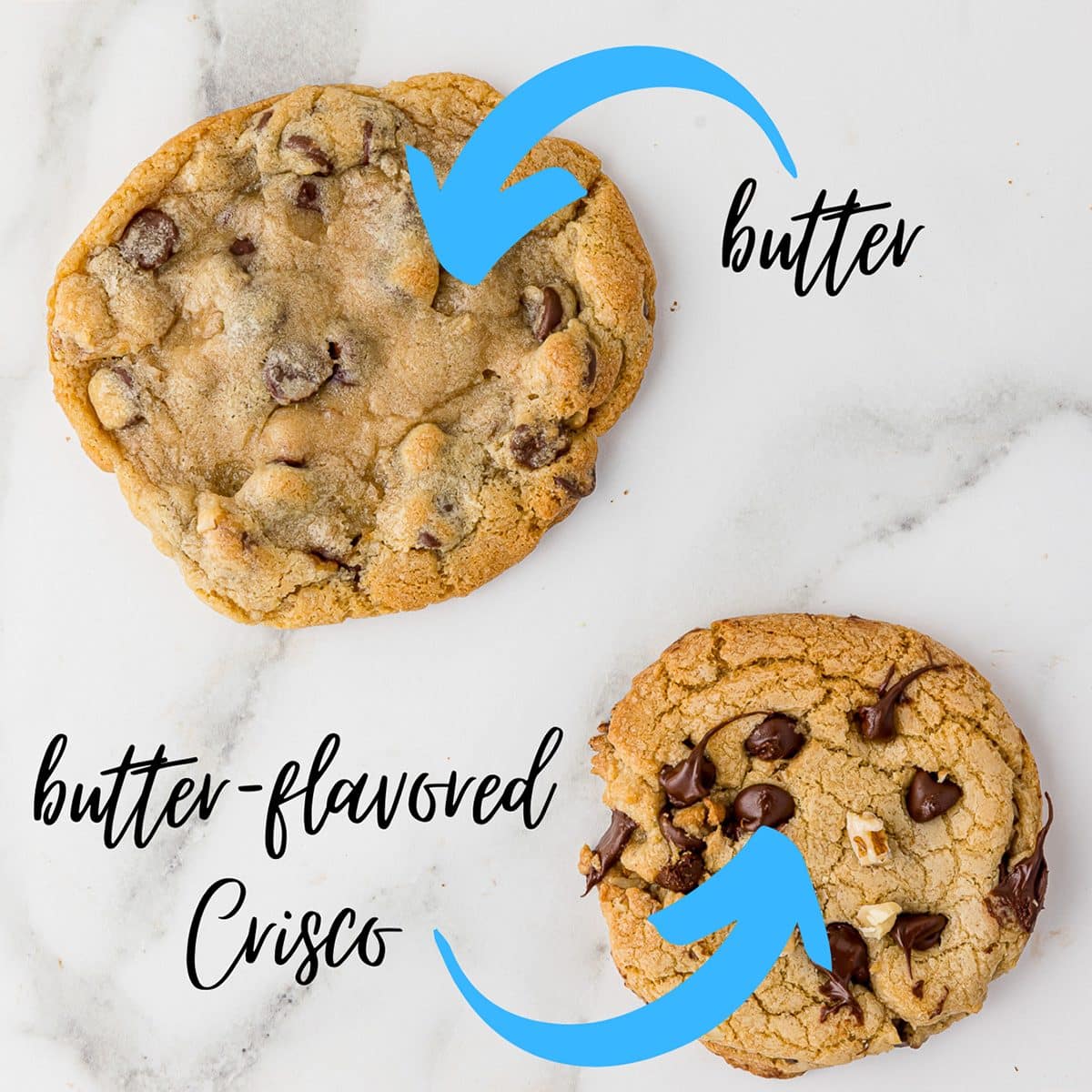 two cookies on a white marble counter top showing the difference between using butter and butter-flavored crisco. The butter cookie is flat and spread out. The other is tall and crispy