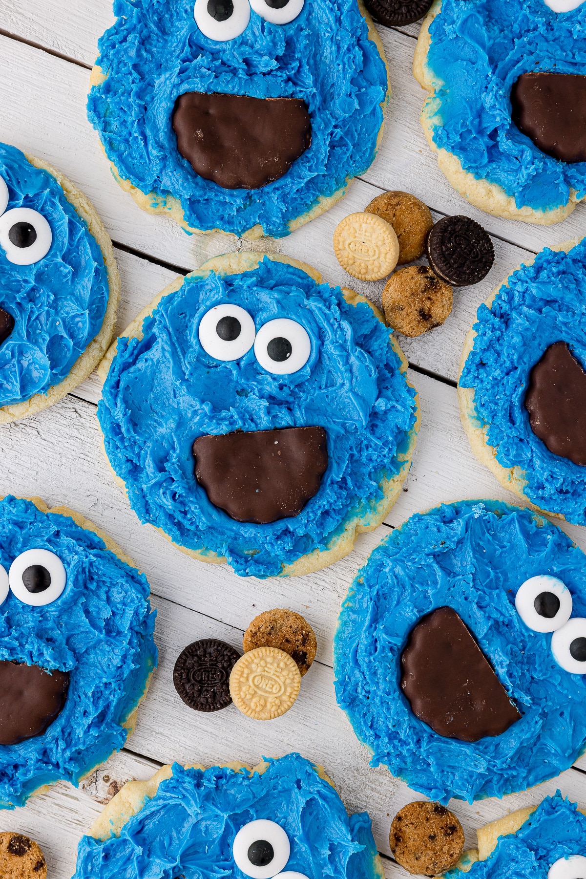 homemade cookie monster cookies on a white slatboard background