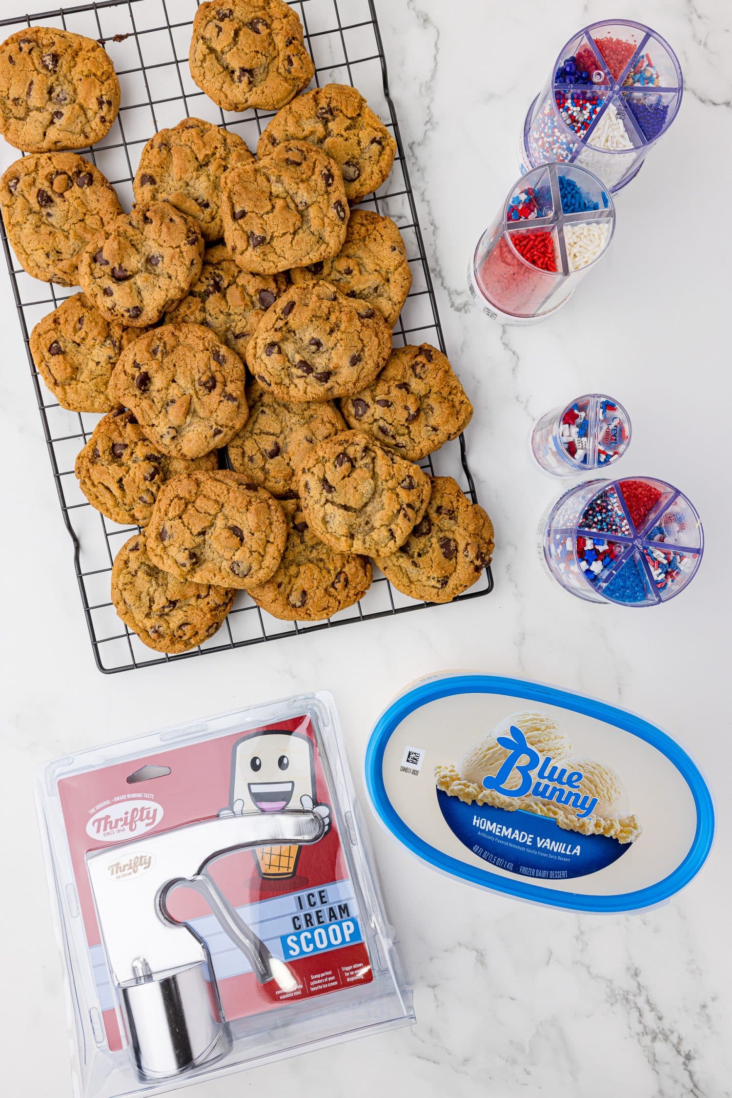 Ingredients for 4th of July ice cream sandwich cookies, including chocolate chip cookies, Blue Bunny vanilla ice cream, and sprinkles