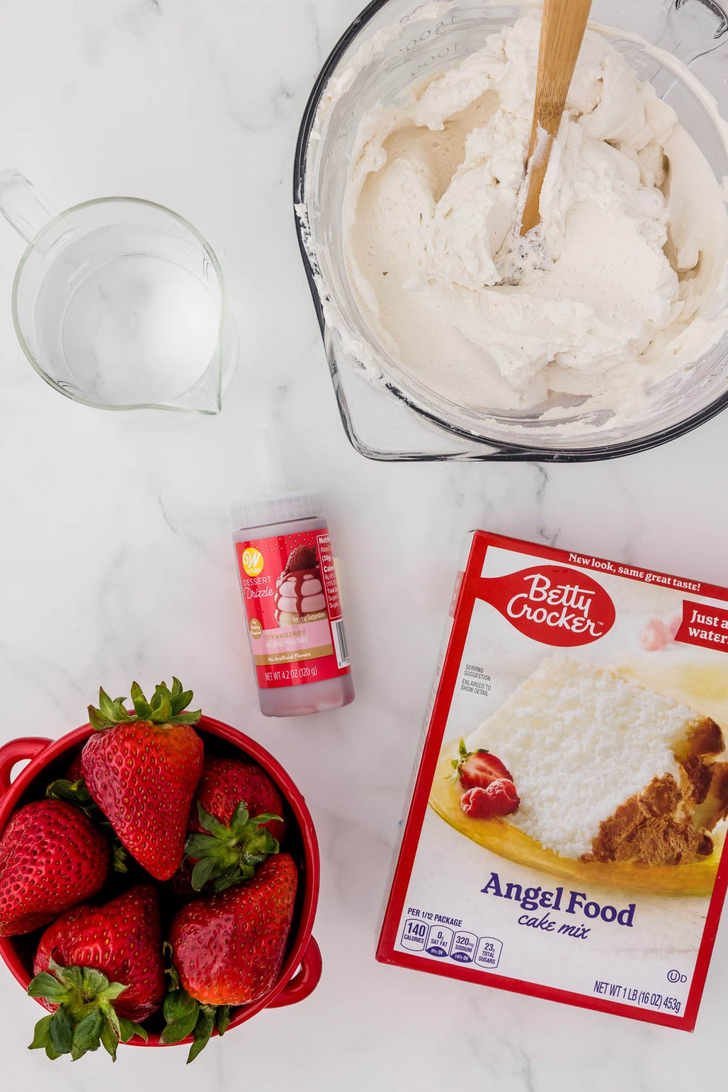 Ingredients for angel food cake on a white countertop