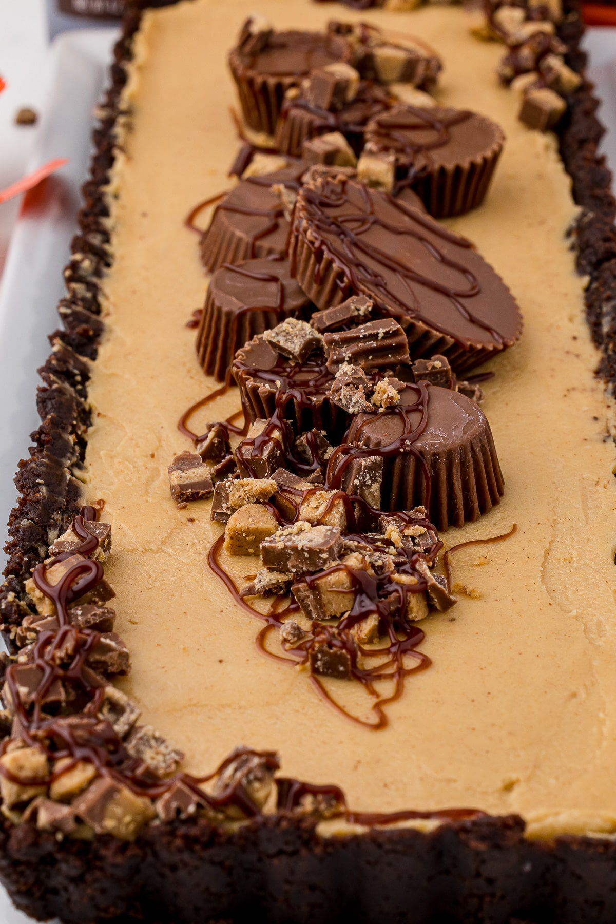 close up of no bake dessert topped with reese's peanut butter cups