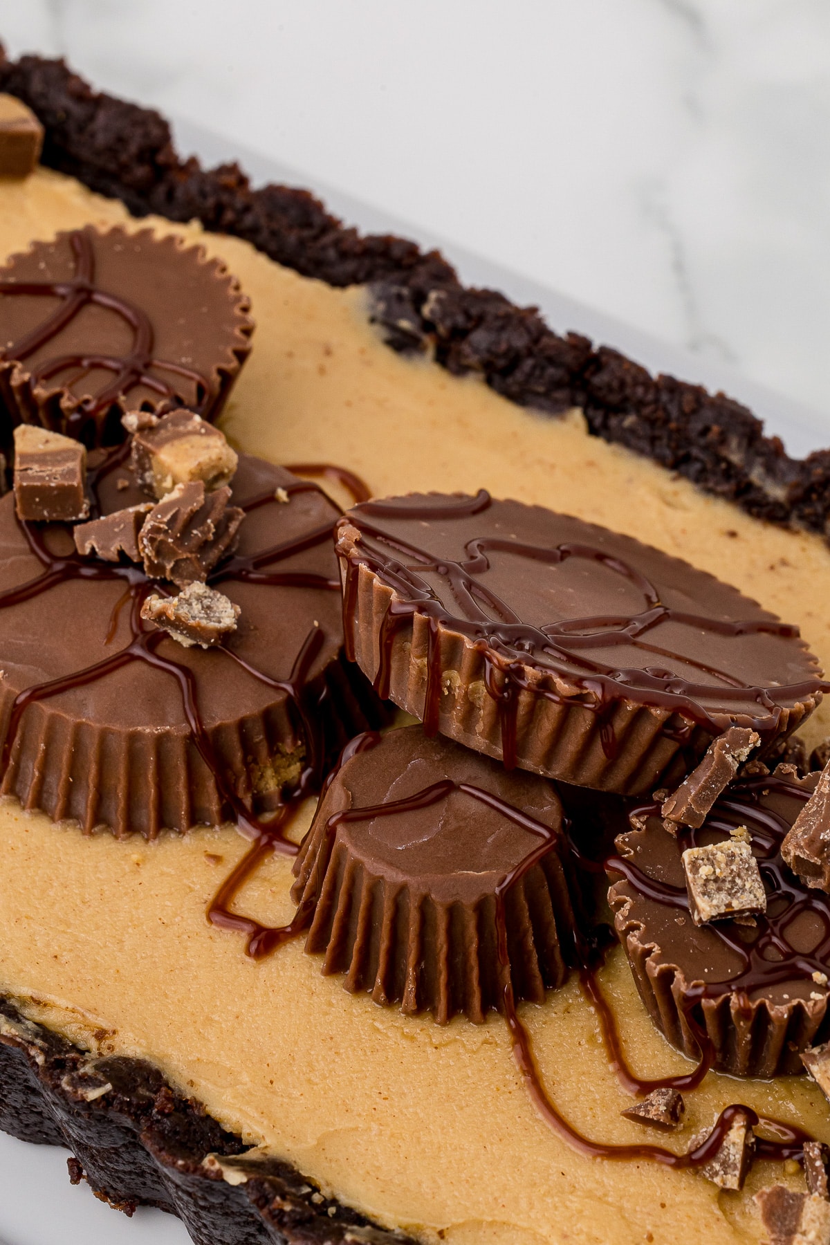 closeup of peanut butter cups with wilton dessert drizzle