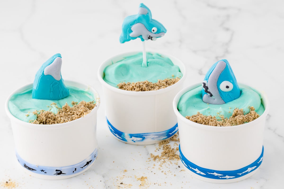 sand pudding dessert cups with chocolate sharks.