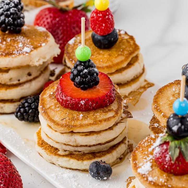 stacks of mini pancakes with fruit