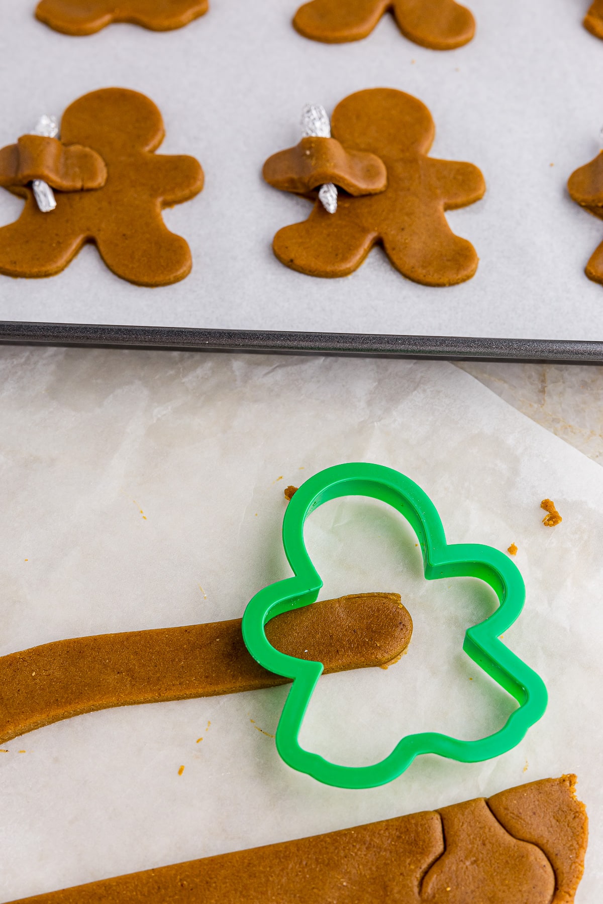 green cookie cutter and cookie dough