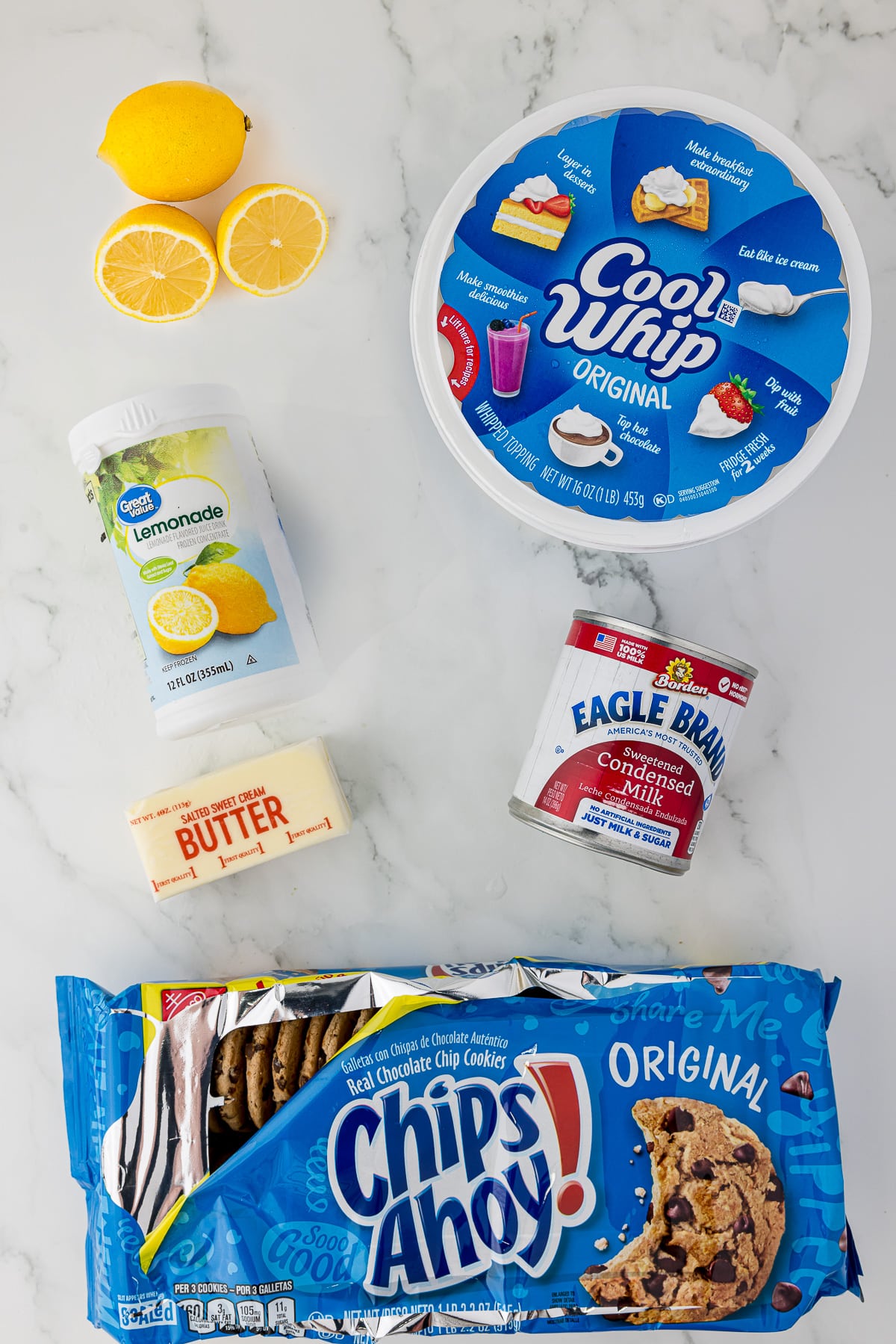 Ingredients needed to make a no bake lemon pie including lemons, Cool Whip, lemonade and Chips Ahoy