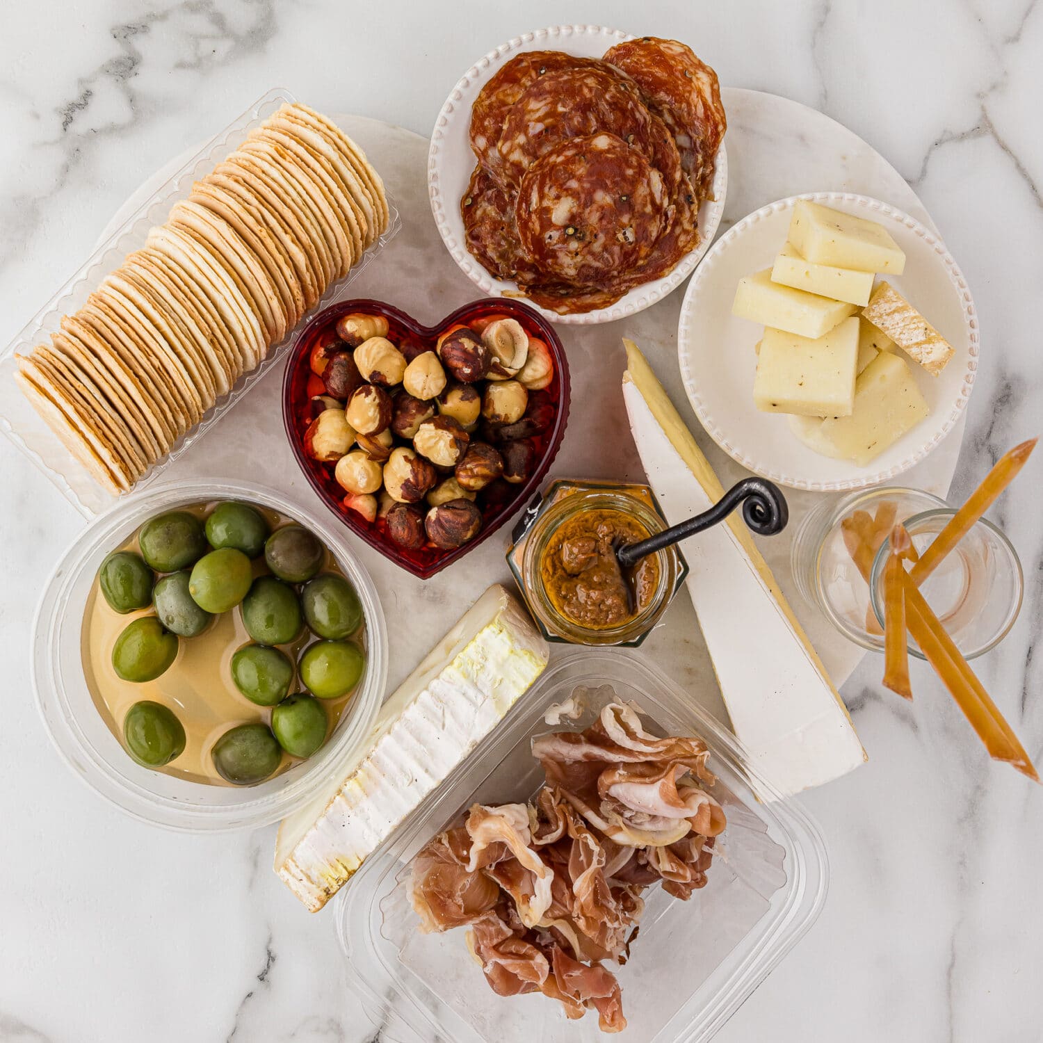 Crackers, Olives, Cheese and meats from an AppyHour Subscription box for charcuterie board