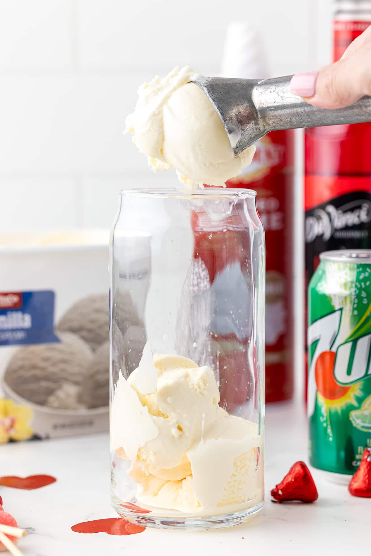 vanilla ice cream going into a glass
