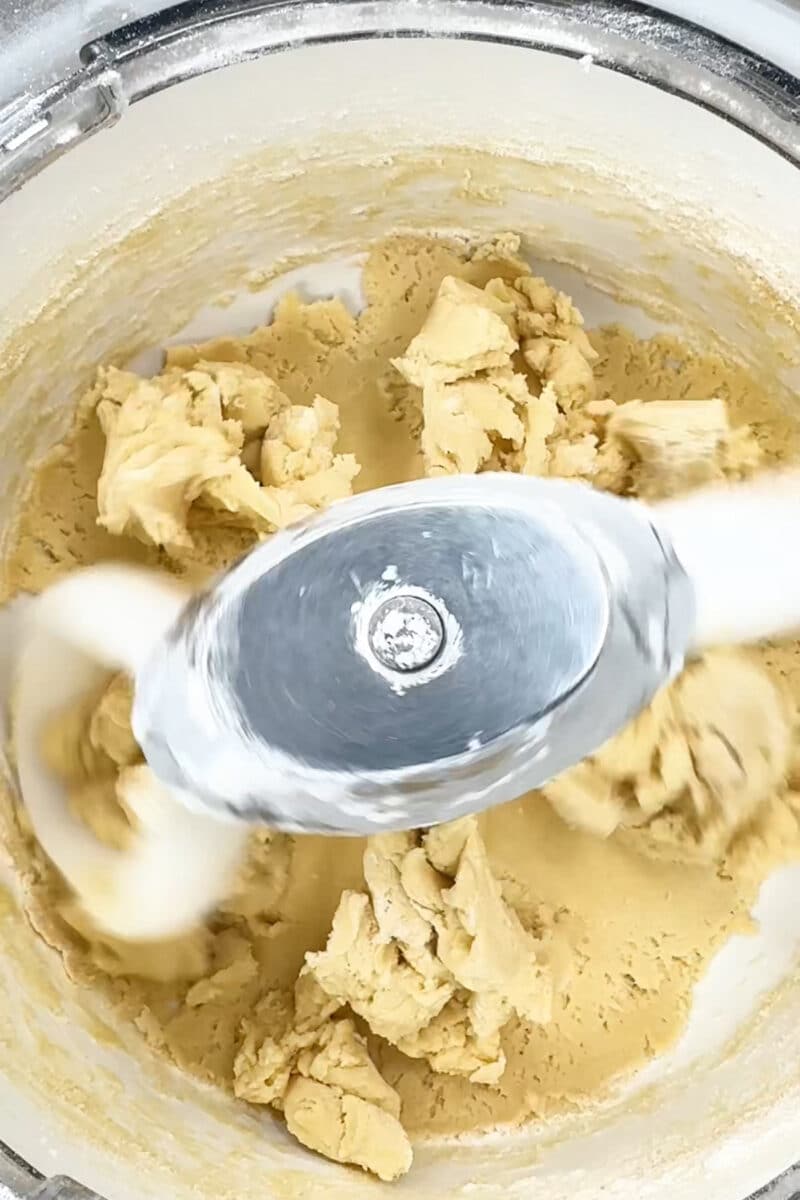 Sugar cookie dough in mixer after adding all wet and dry ingredients