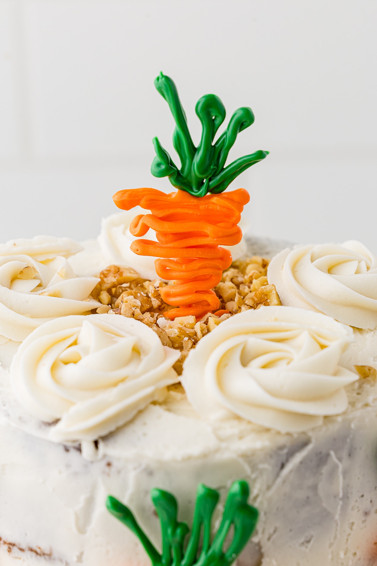 top of carrot cake with candy cake topper