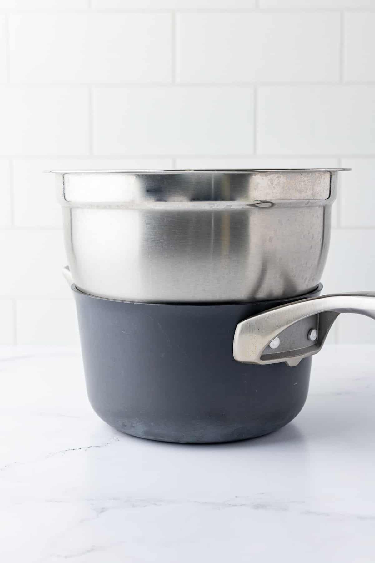 A stainless steel bowl sitting inside a saucepan.
