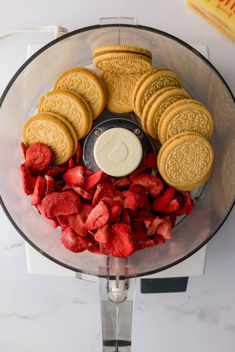 cuisinart food processor with golden oreos and sliced freeze dried strawberries