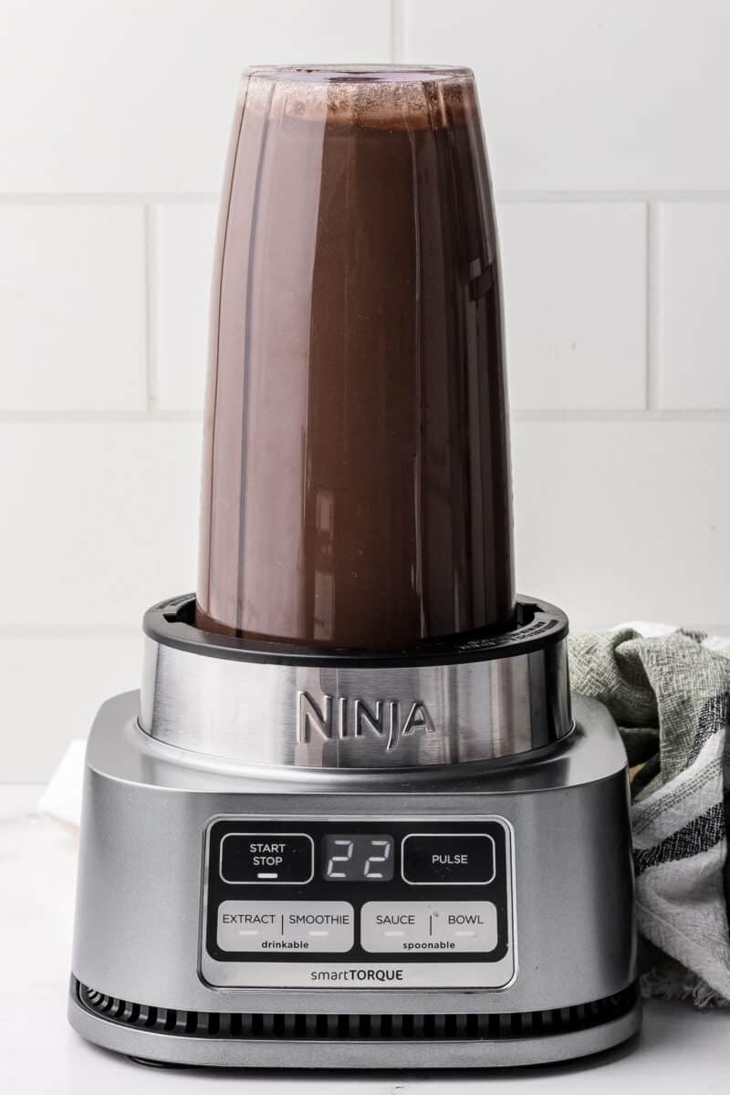 ninja blender with dark chocolate ice cream mixture inside