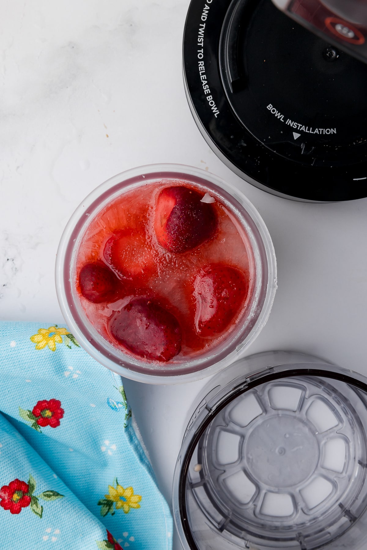 frozen strawberries in lemonade in a ninja creami pint jar