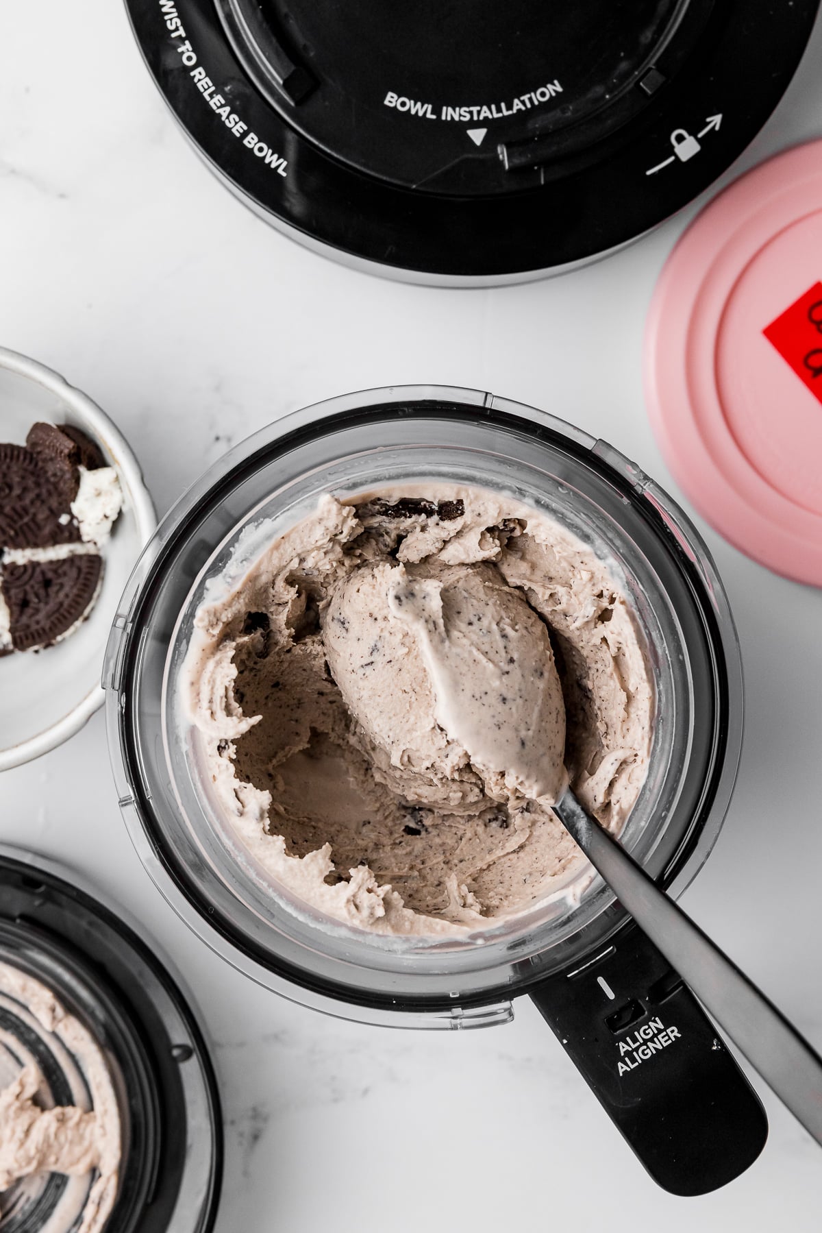 overhead photo of ninja creami cookies and cream ice cream in the pint jar outer bowl