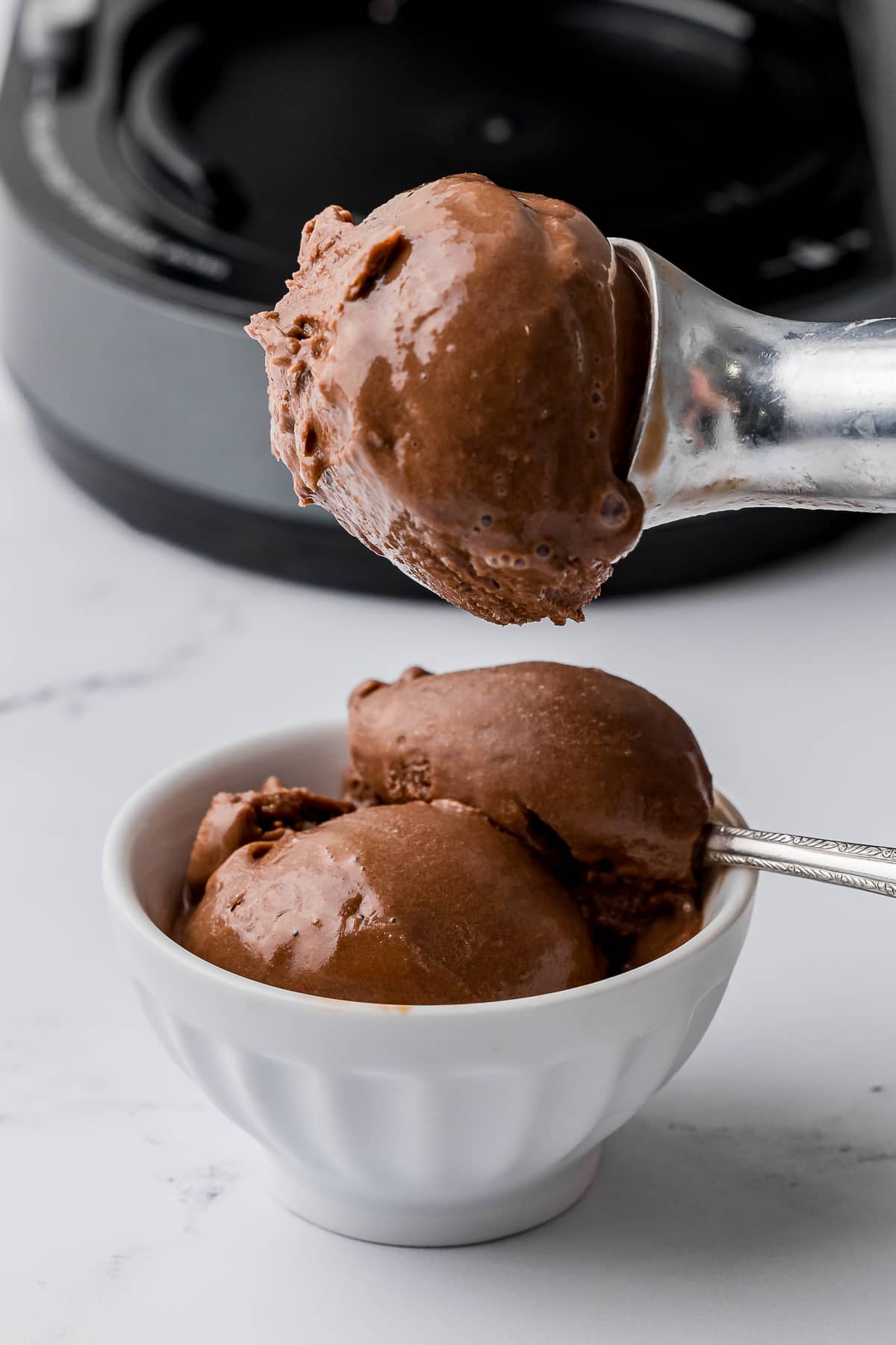 scoop of chocolate ice cream on an ice cream scoop