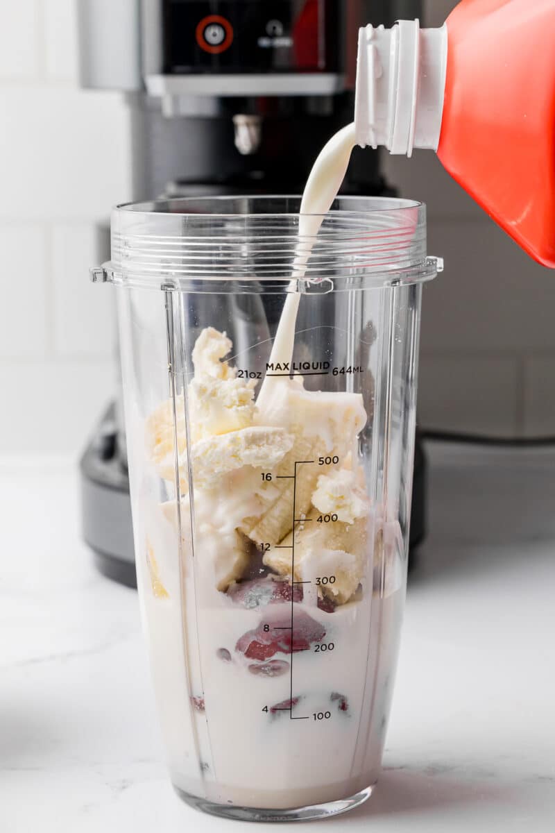 ingredients for strawberry banana ice cream in the blender attachment