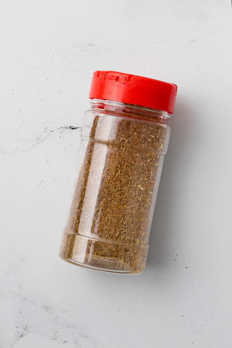 spice jar of gluten free taco seasoning on a white countertop