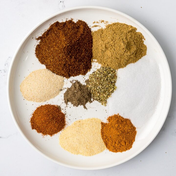 overhead photos of individual spices on a white plate