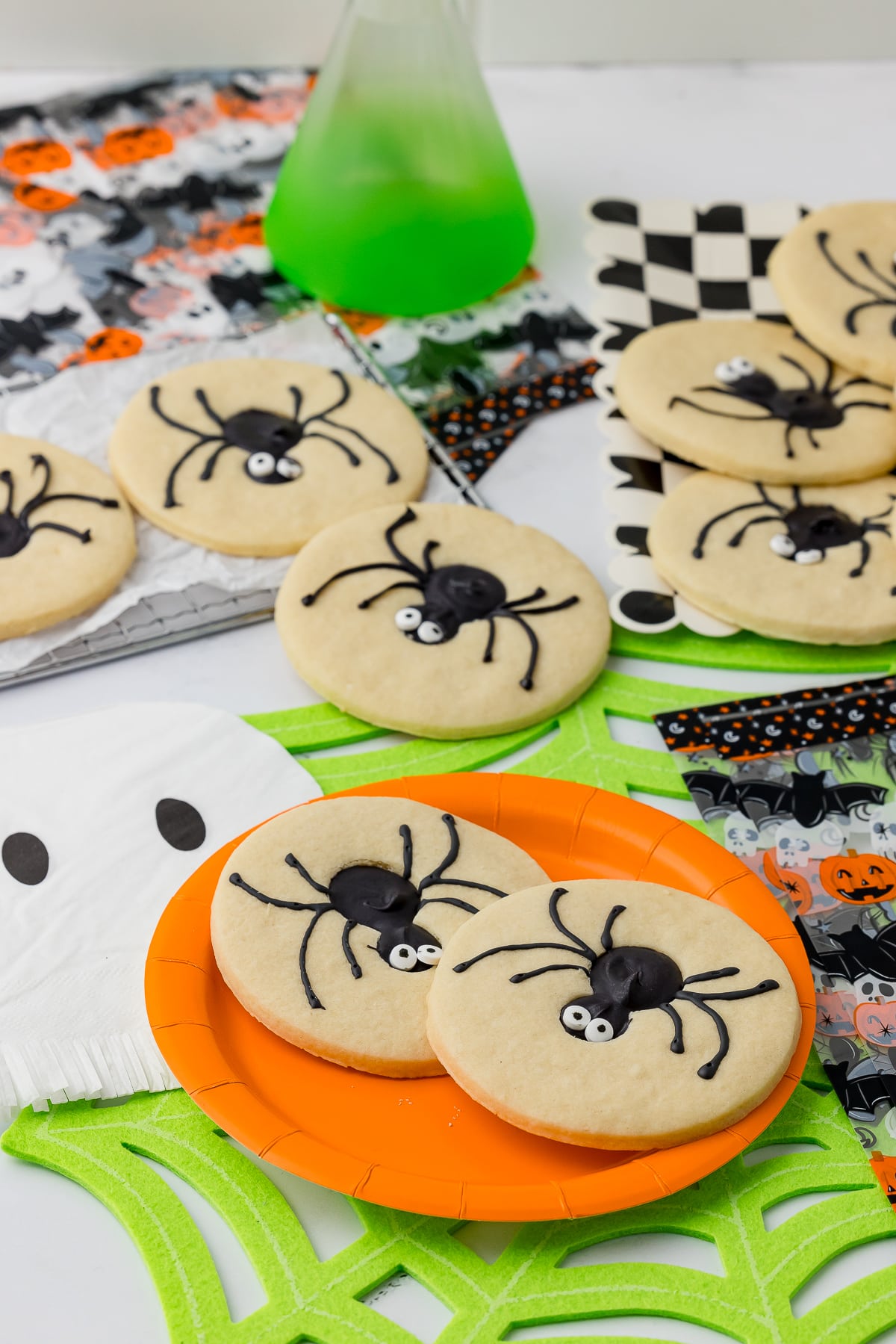 Spider sugar on a orange plate on a neon green spiderweb