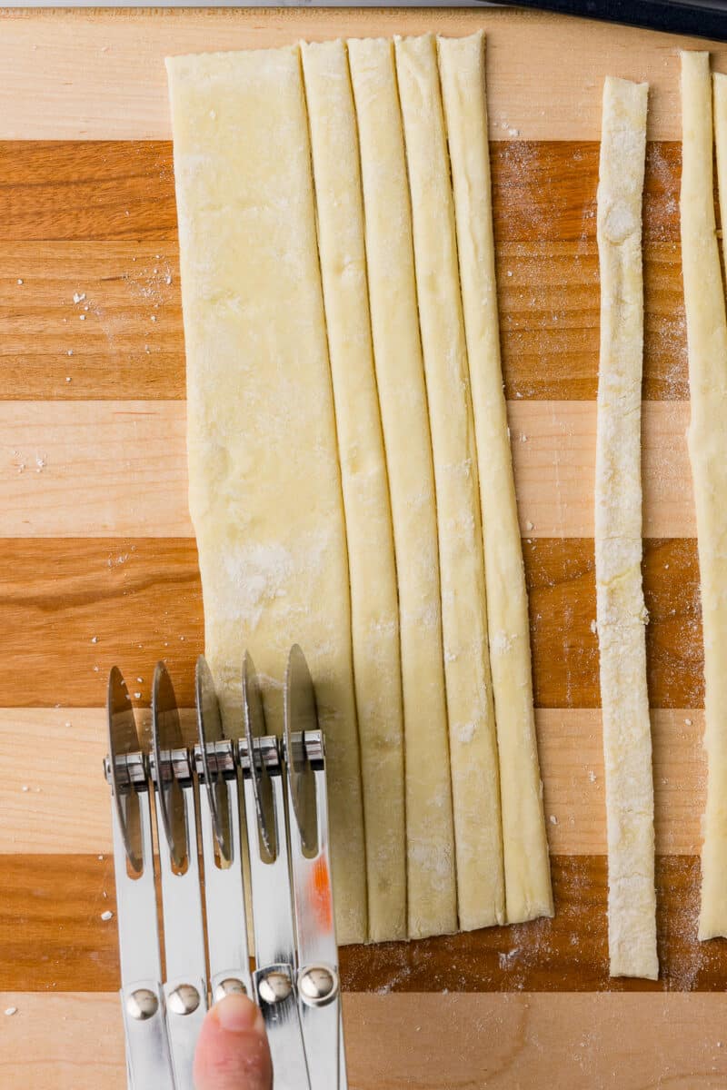 5 bladed cutter cutting strips of puff pastry