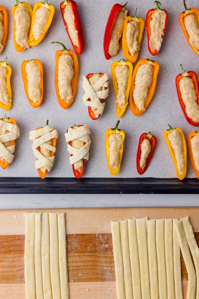 puff pastry strips wrapped around tri color peppers filled with cottage cheese queso