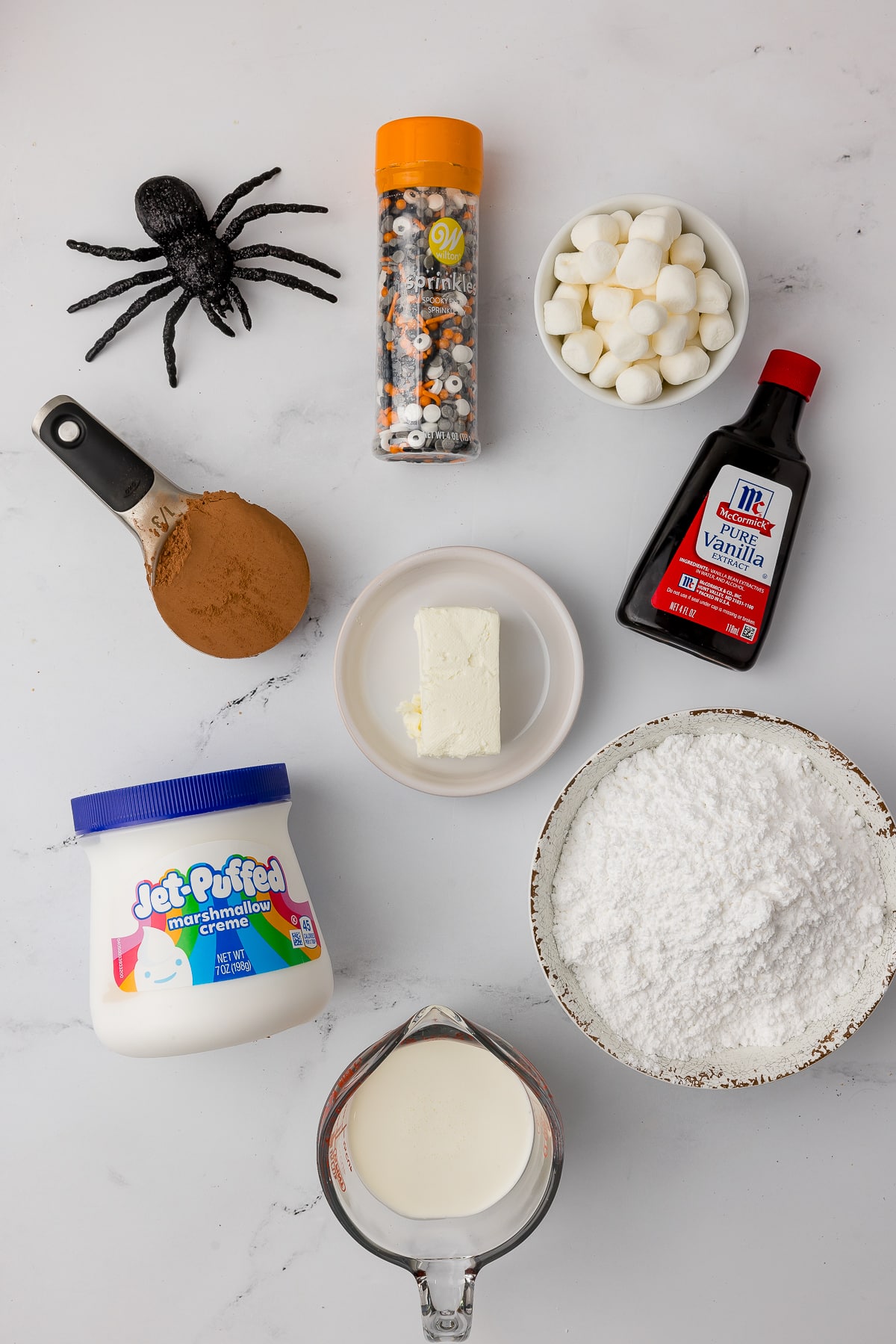 Ingredients for homemade Halloween party dip including Jet Puffed marshmallow, vanilla, cocoa powder and more