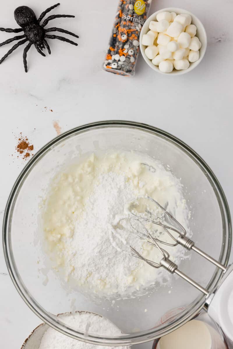 Whipping up ingredients for a Halloween dip