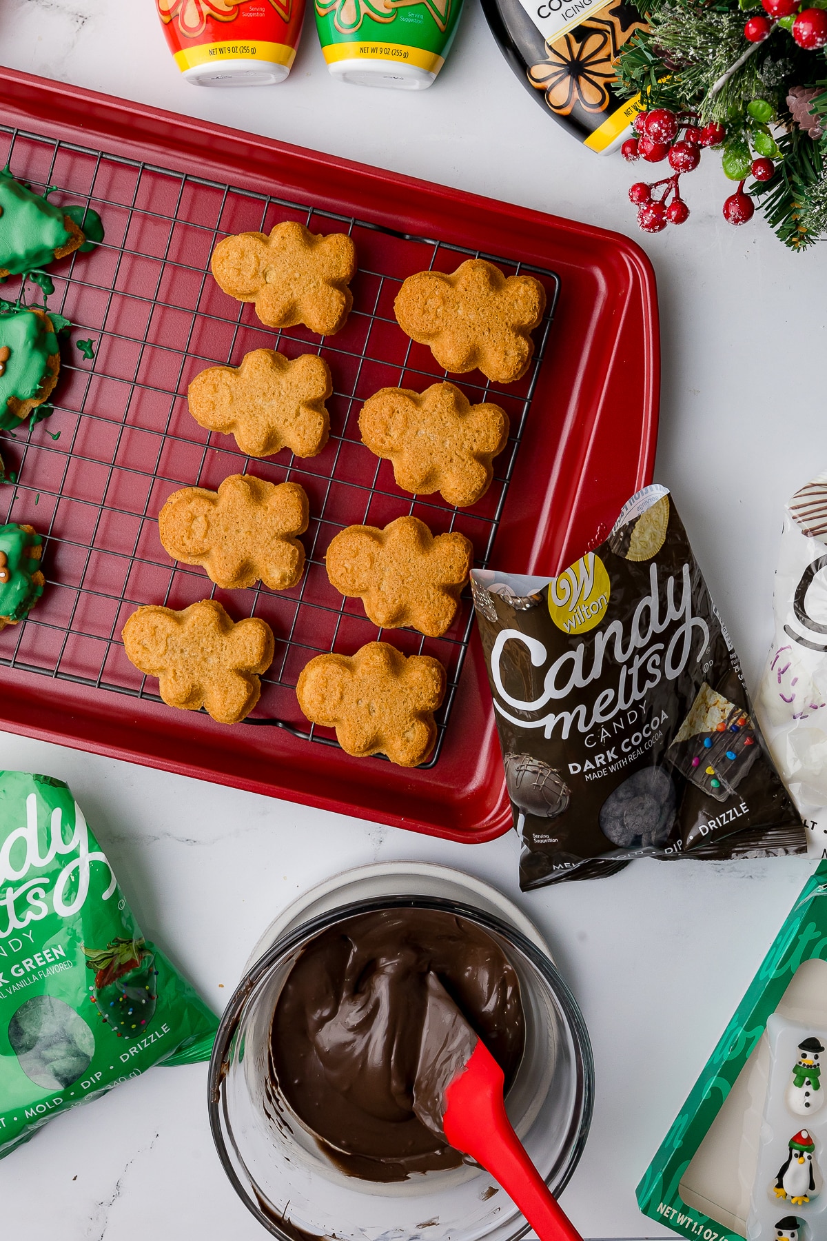 A tray of unfrosted cookies with Wilton chocolate melts