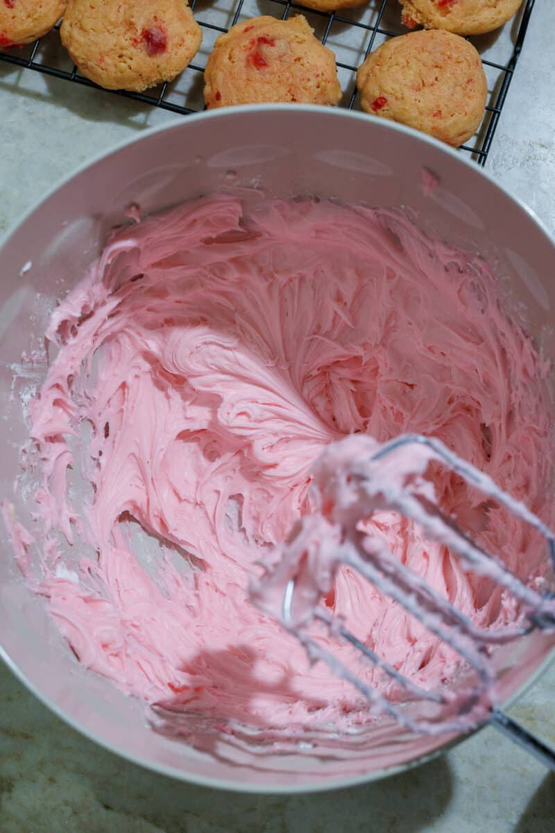 pink frosting in a batter bowl