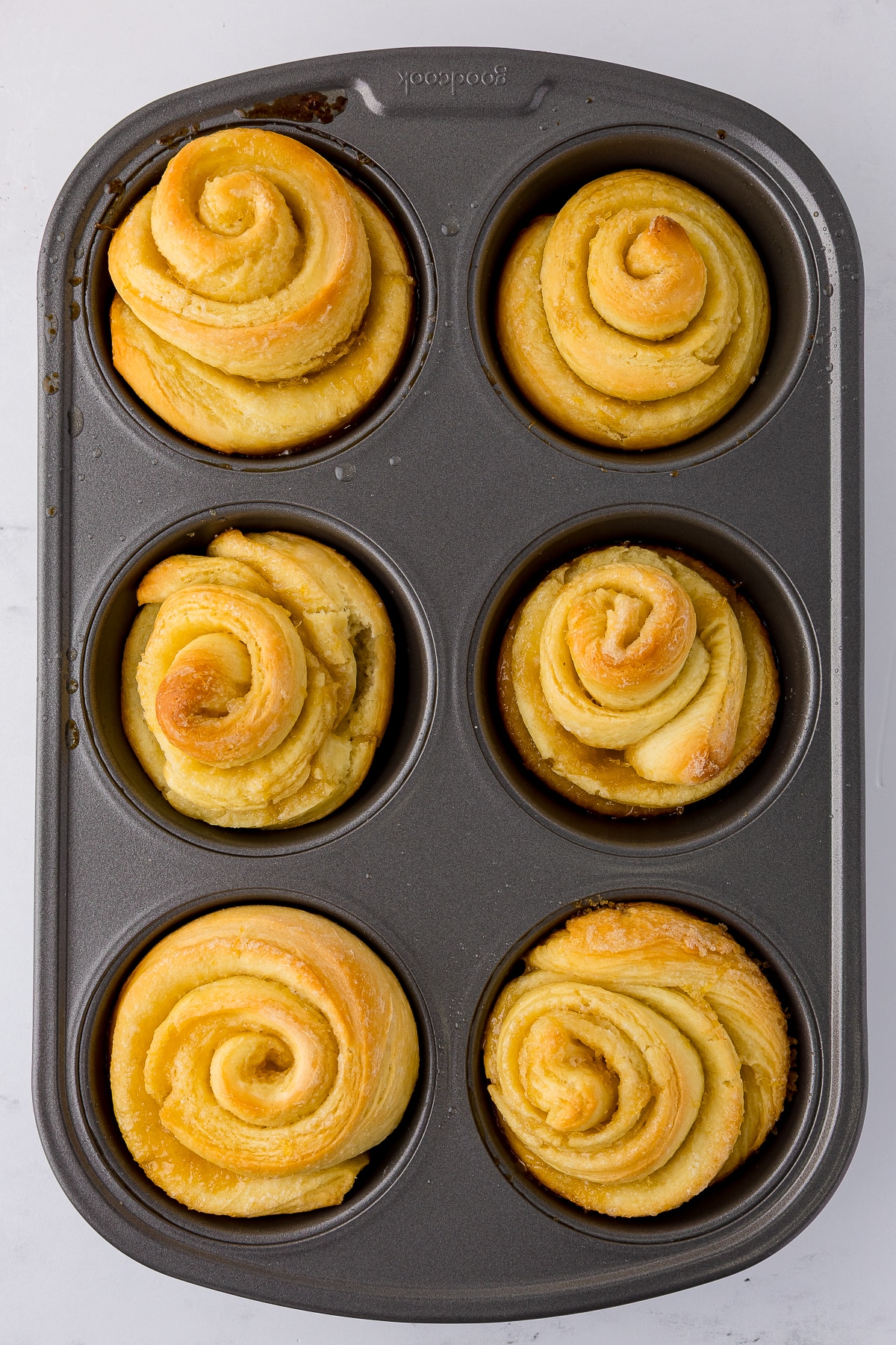 baked lemon rolls in muffin tin