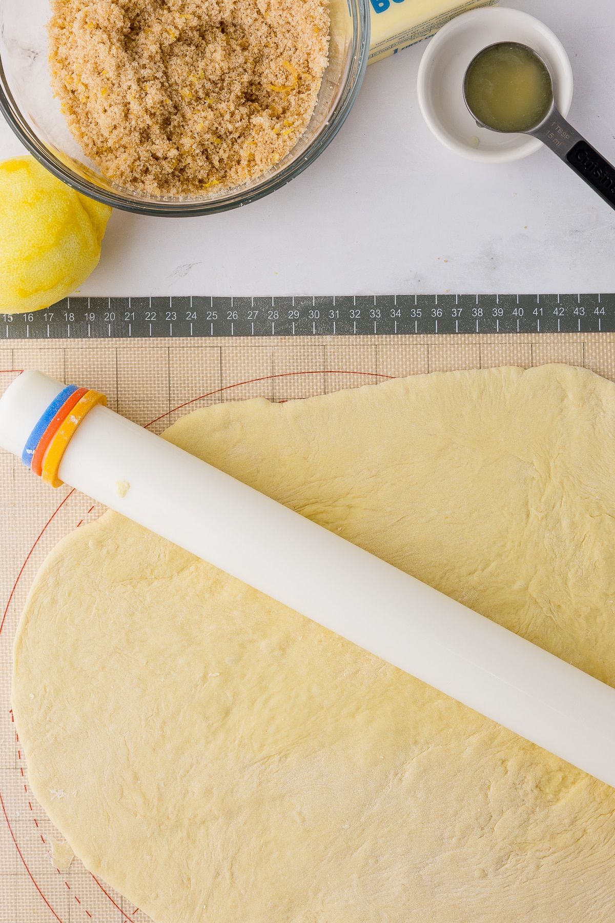 rolling out dough on a mat