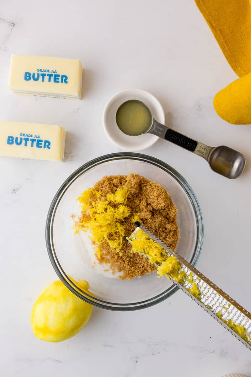 lemon zest, brown sugar, and white sugar in a bowl