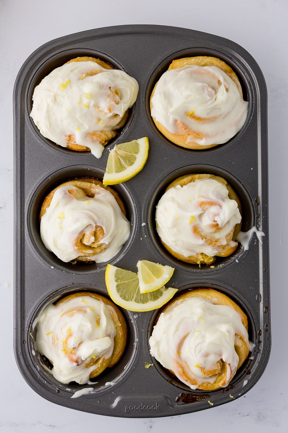 frosted lemon rolls in muffin pan