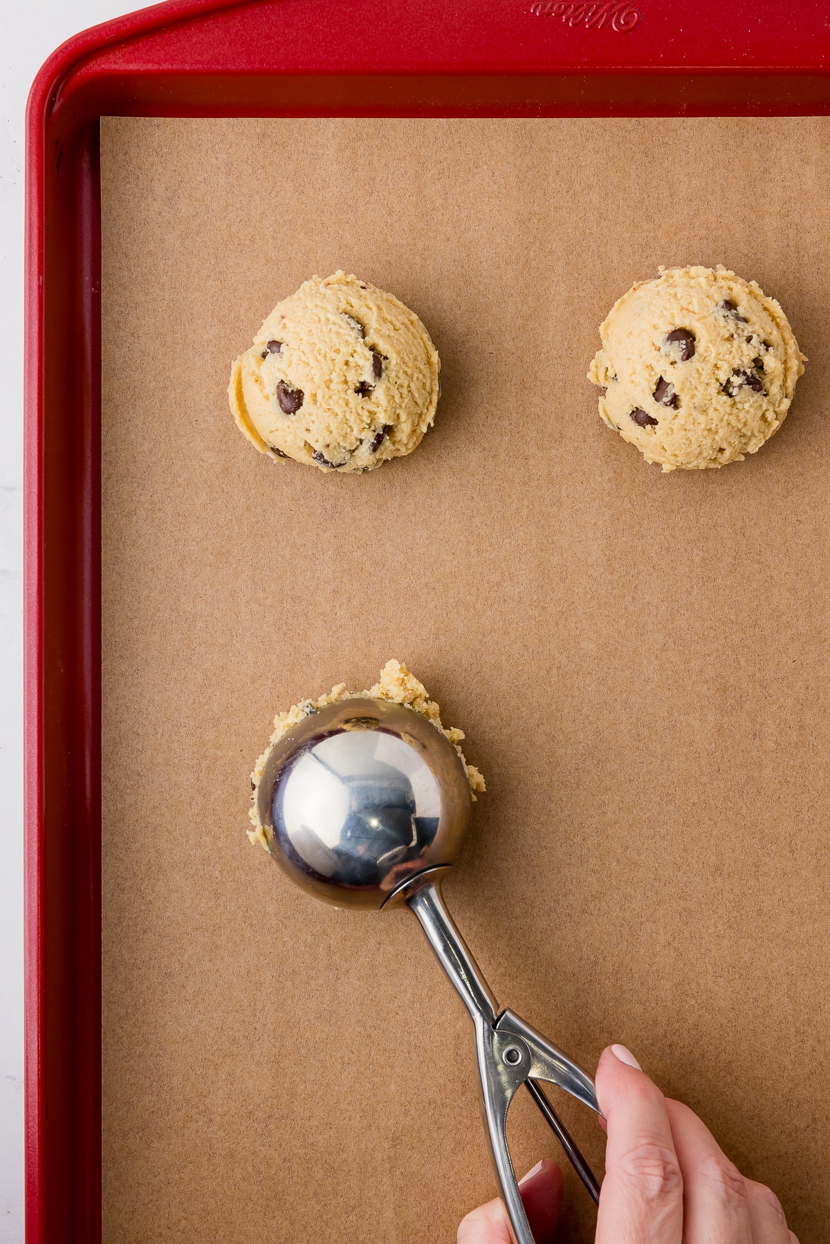 cookie scoop with cookie dough balls