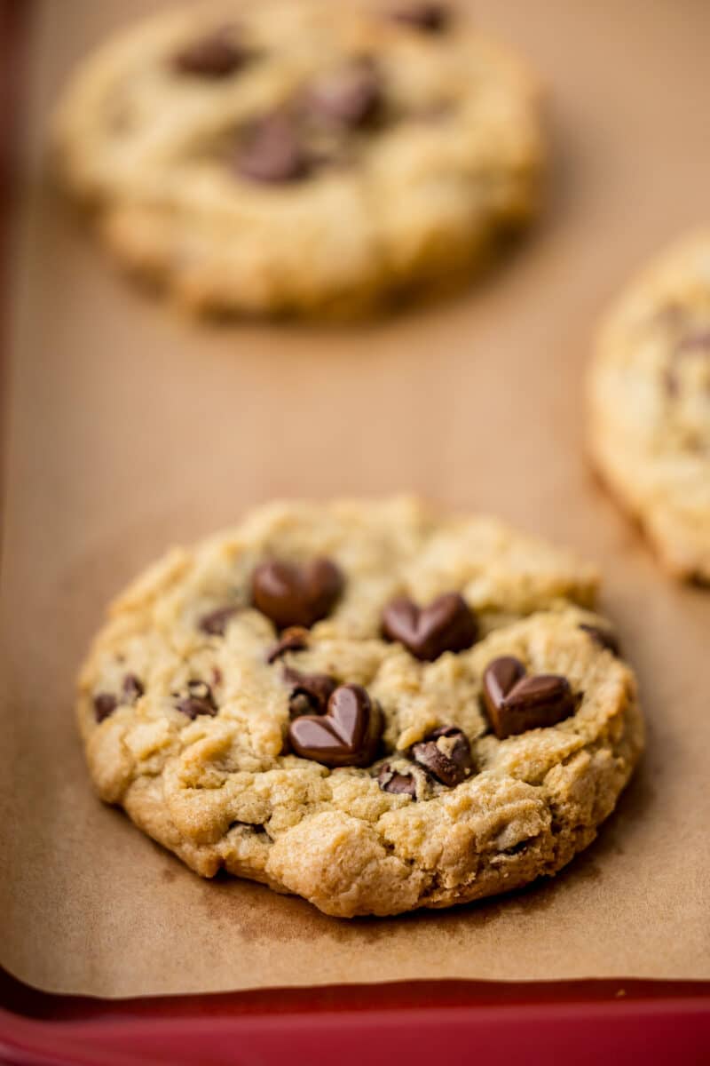 chocolate chip cookie on a cookie sheet lined with parchment paper