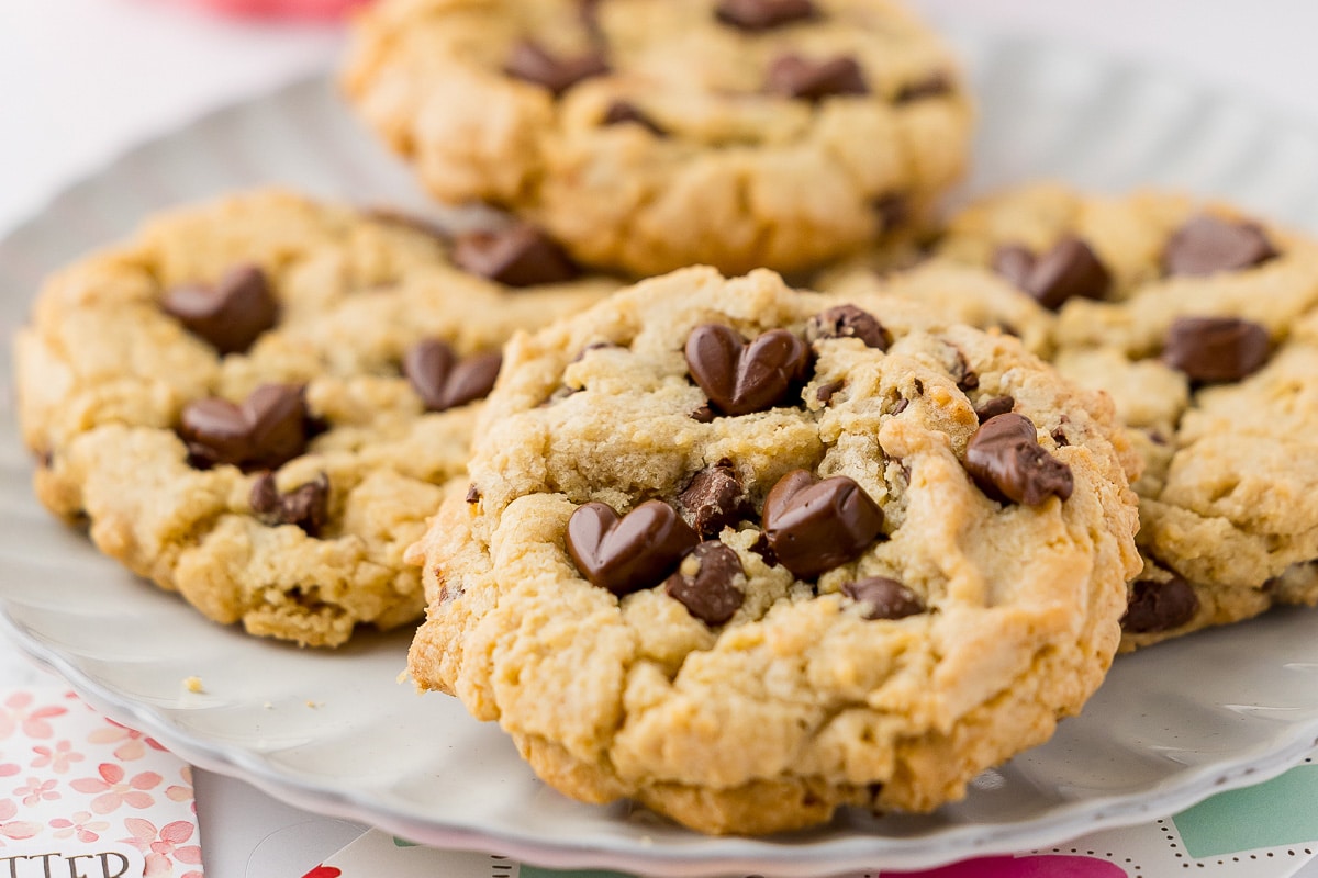 four chocolate chip cookies on a plate