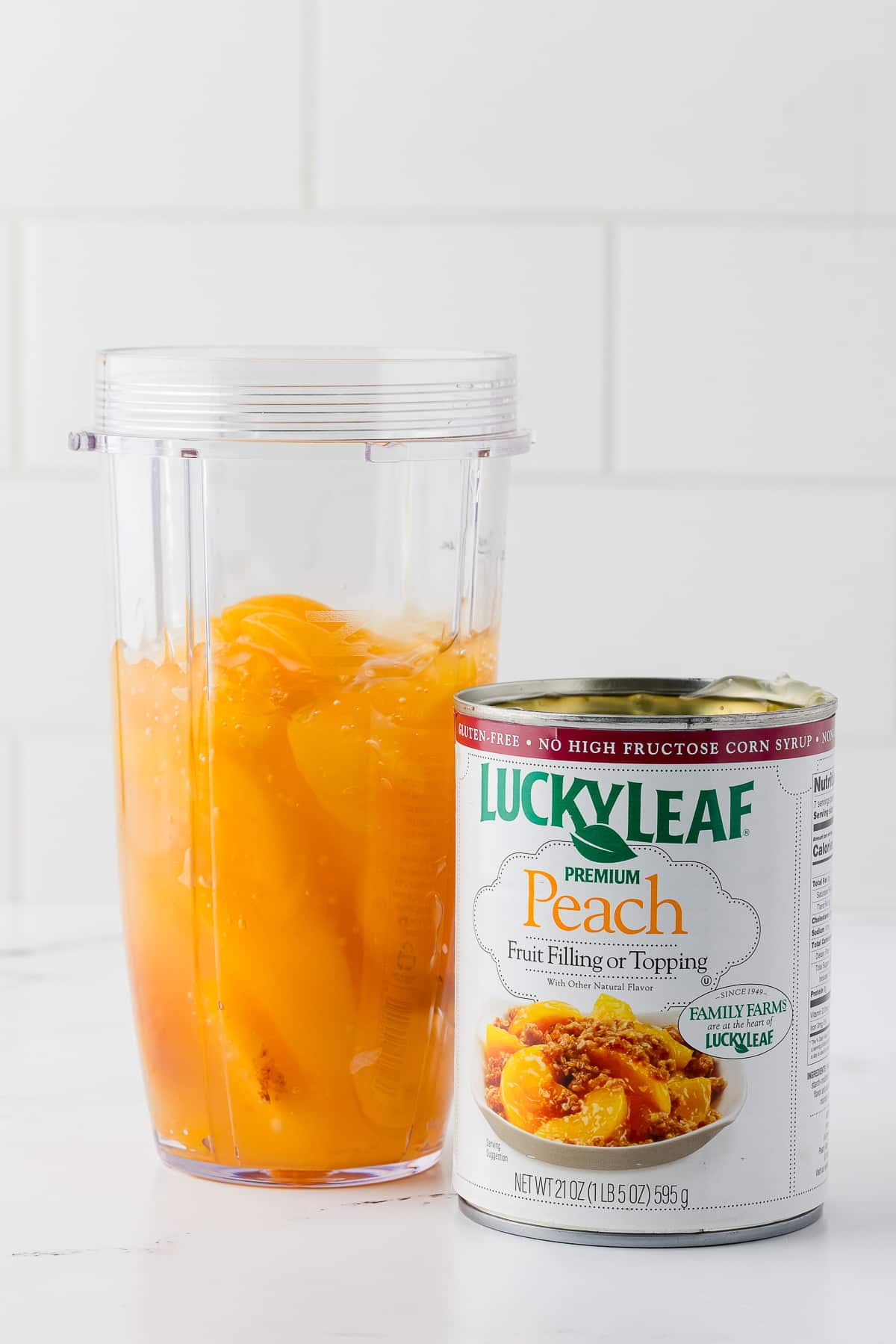 can of peach fruit filling and a the filling in the blender cup