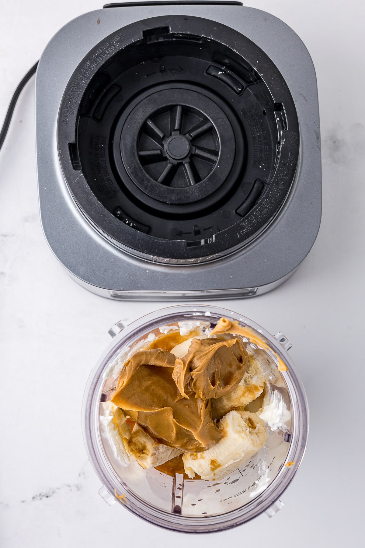 peanut butter, greek yogurt, banana, and other ingredients for frozen yogurt in the blender