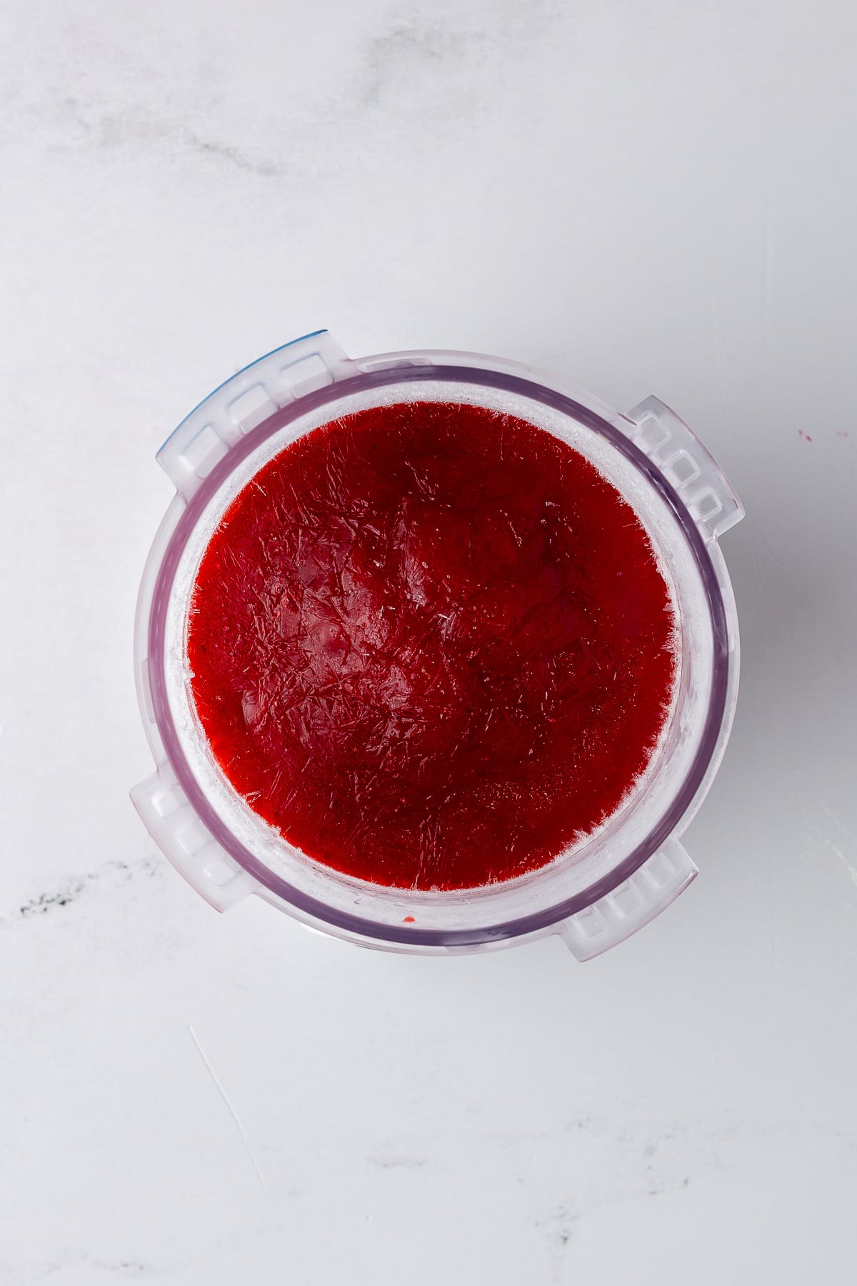 frozen strawberry ice cream in a pint jar for ninja creami