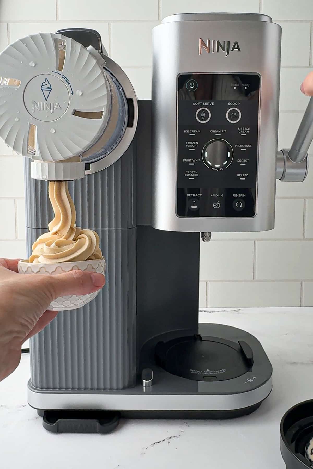 frozen yogurt dispensed from the ninja creami swirl