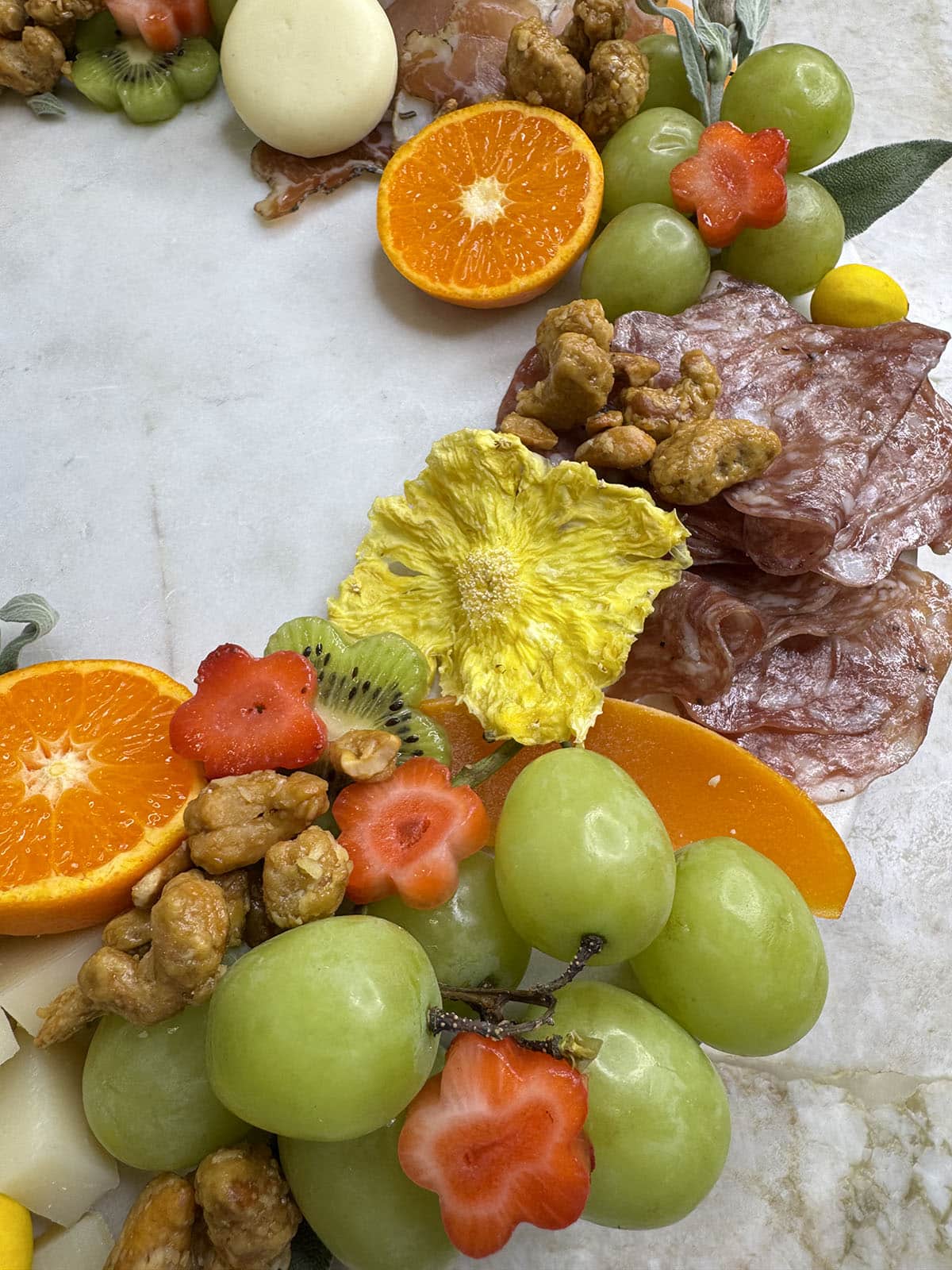 Close up of the fruit in a holiday charcuterie wreath board