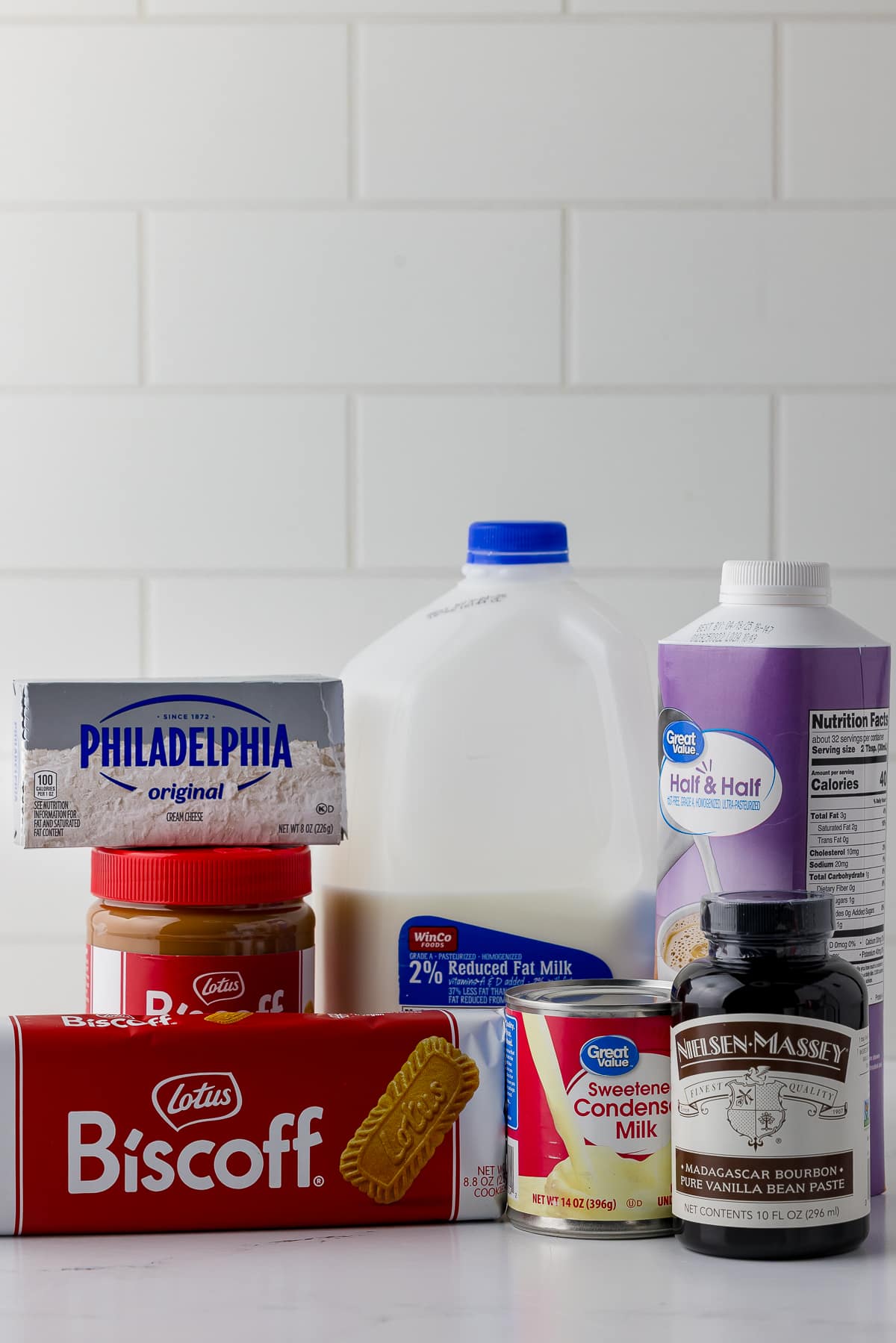 ingredients for ninja swirl biscoff ice cream on a white counter