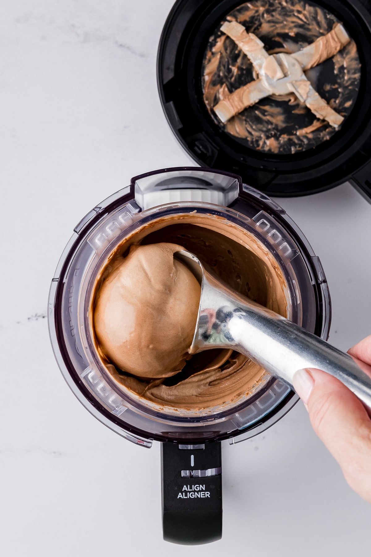 ice cream scooping out nutella ice cream in a ninja creami pint jar