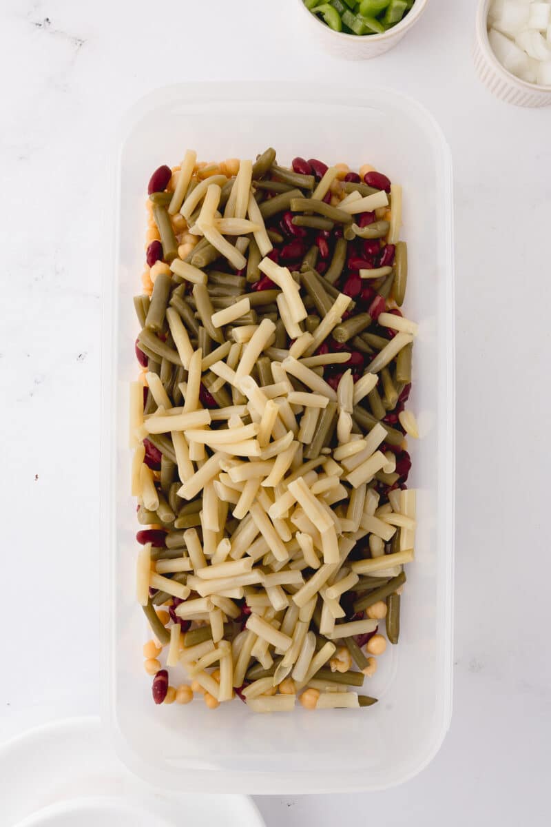 tupperware rectangular dish with all of the beans inside