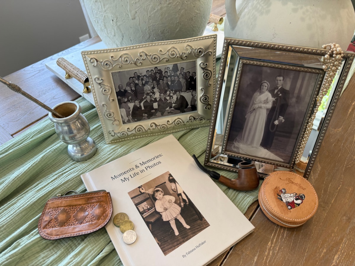Remento book on a table with photos and other memorabilia