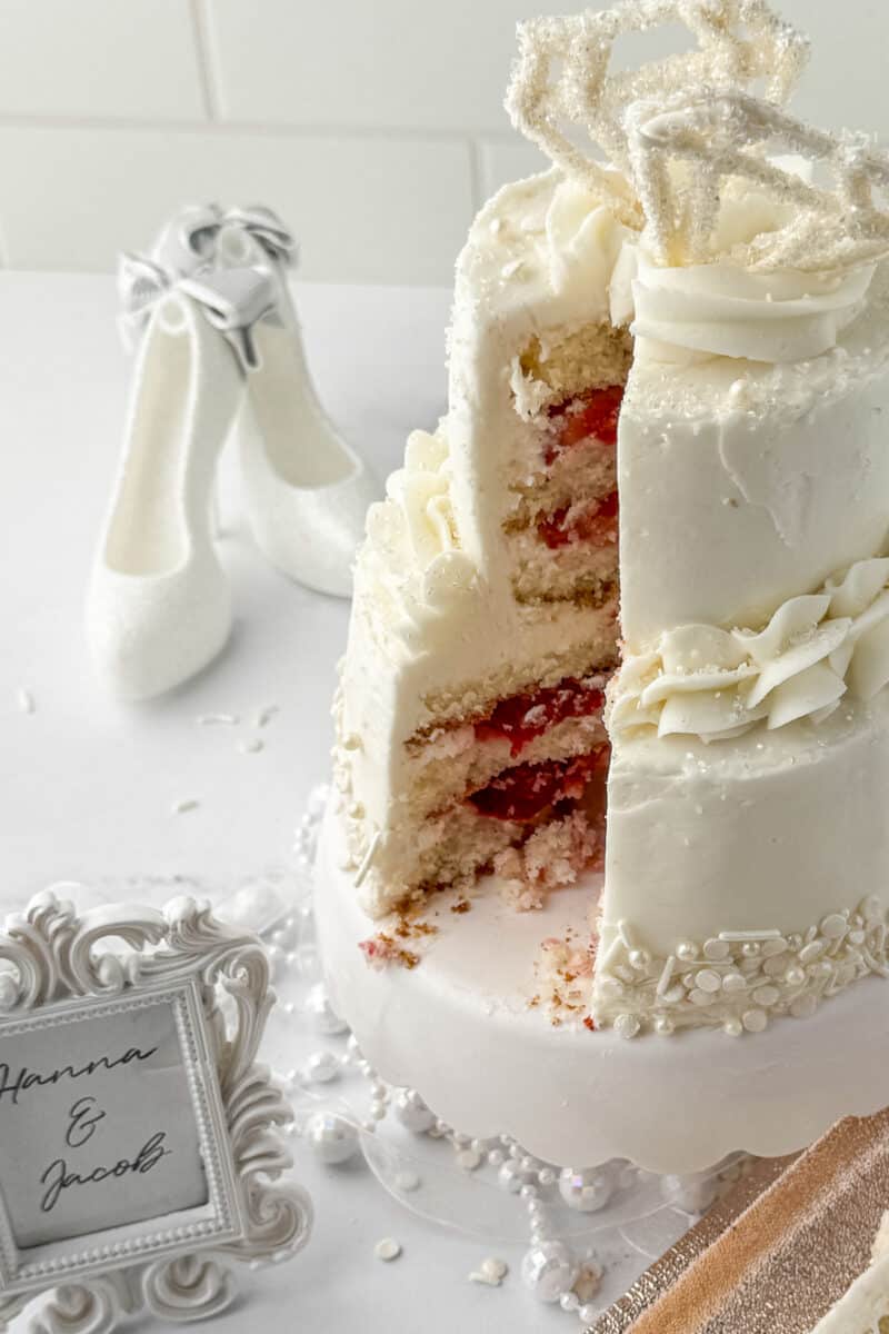 mini engagement cake with strawberries on a white mini cake stand